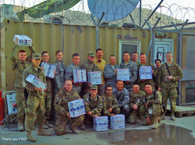 Soldiers holding FSO care packages